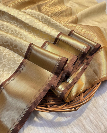 Graceful Cream Katan Silk Banarasi Saree with Brown Border