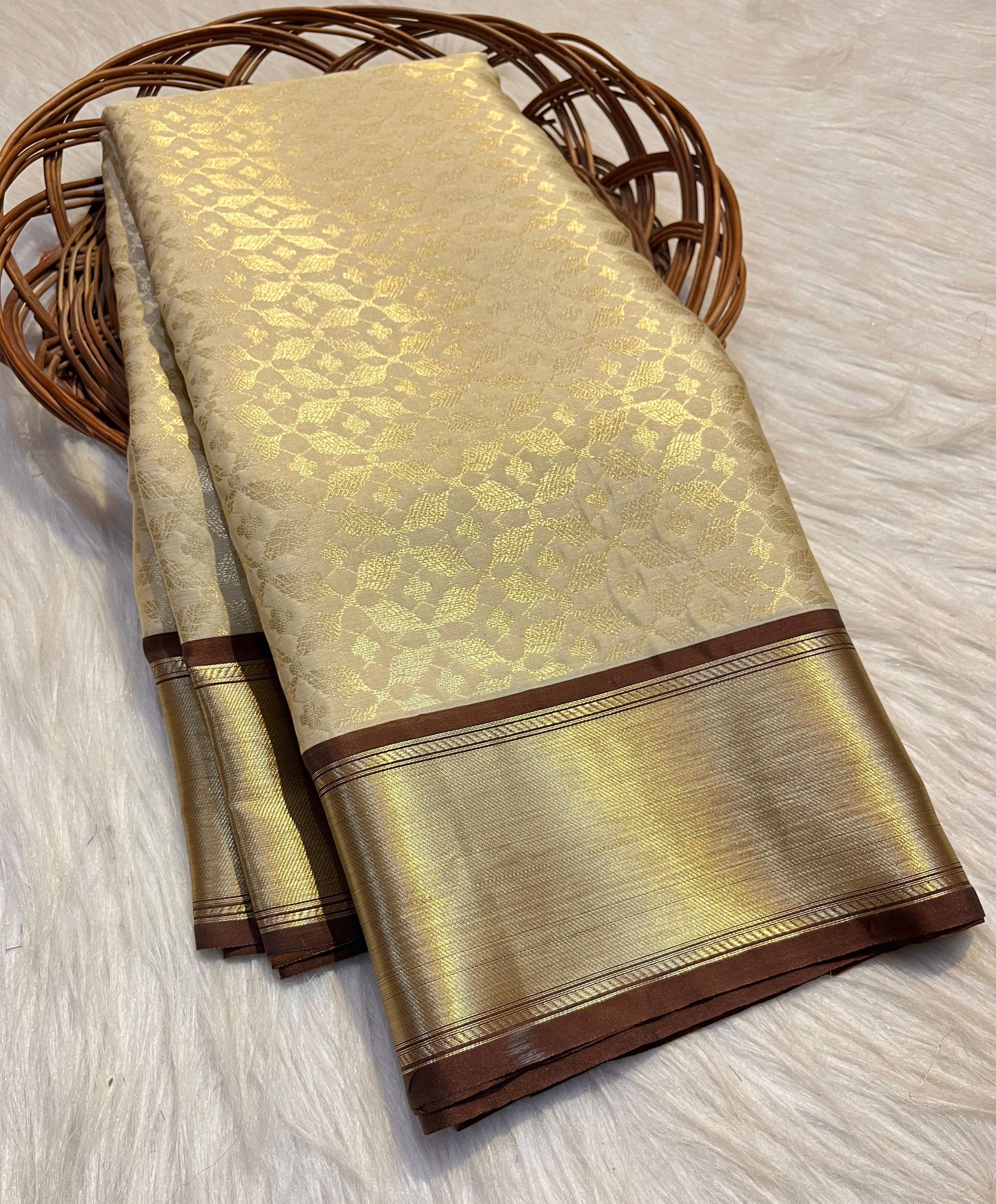 Graceful Cream Katan Silk Banarasi Saree with Brown Border