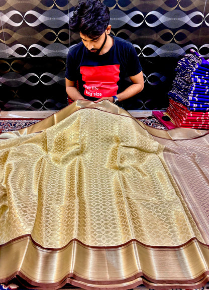 Graceful Cream Katan Silk Banarasi Saree with Brown Border