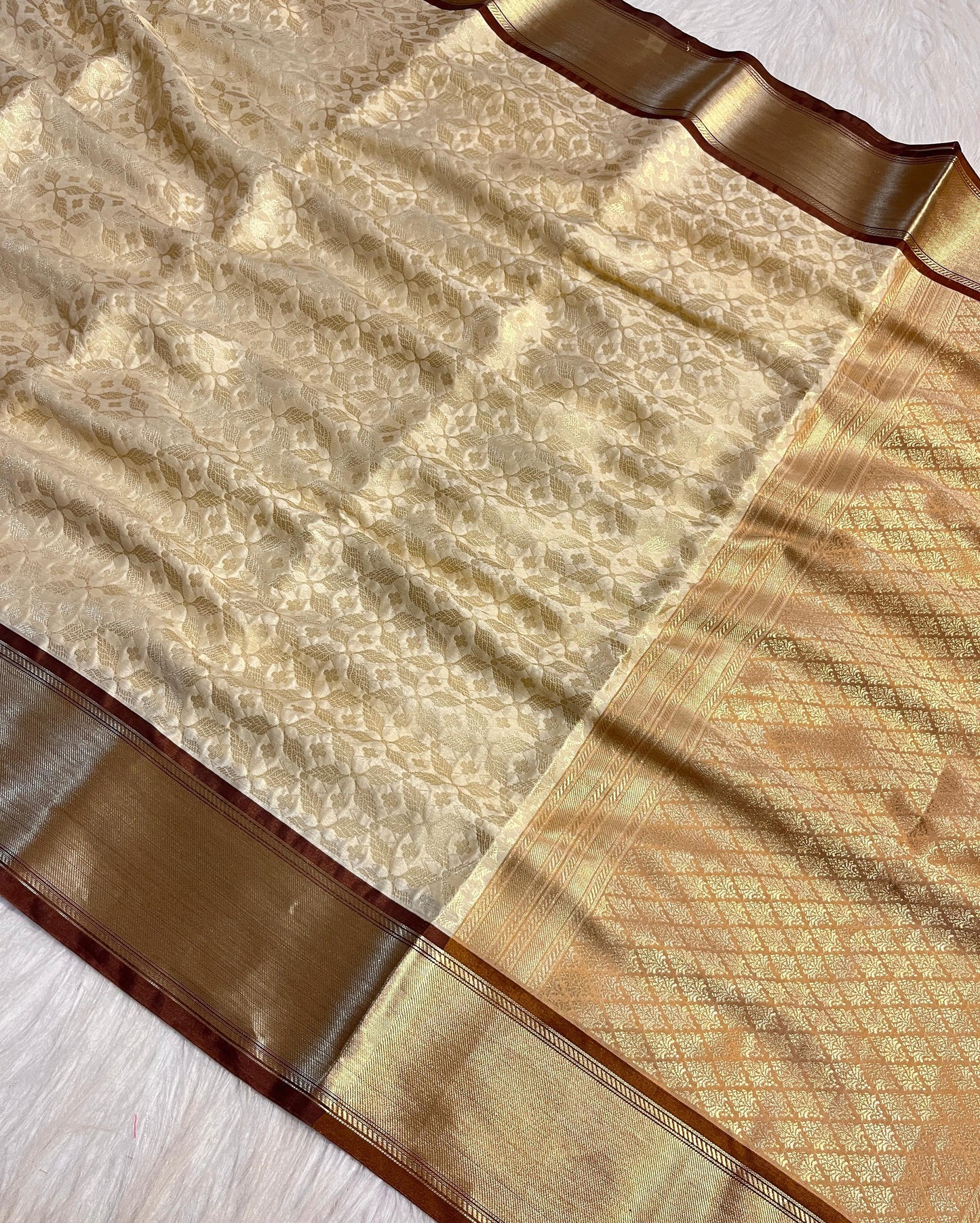 Graceful Cream Katan Silk Banarasi Saree with Brown Border