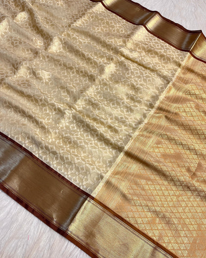 Graceful Cream Katan Silk Banarasi Saree with Brown Border