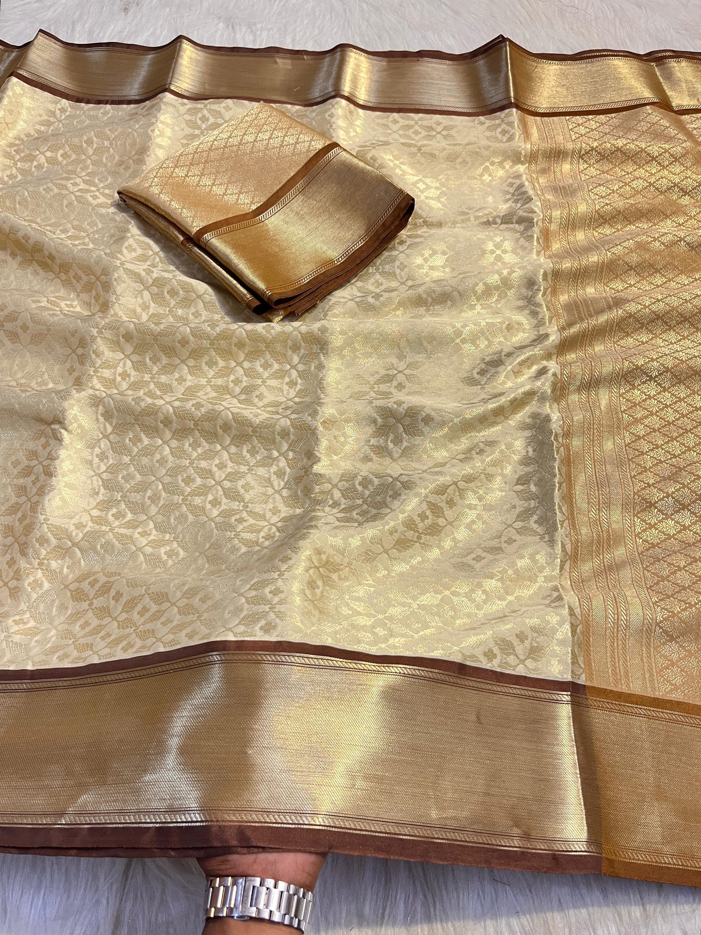 Graceful Cream Katan Silk Banarasi Saree with Brown Border