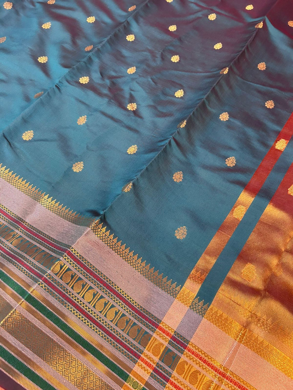 Royal Peacock Blue Banarasi Katan Silk Saree with Rich Zari Buti & Contrast Copper Gold Pall