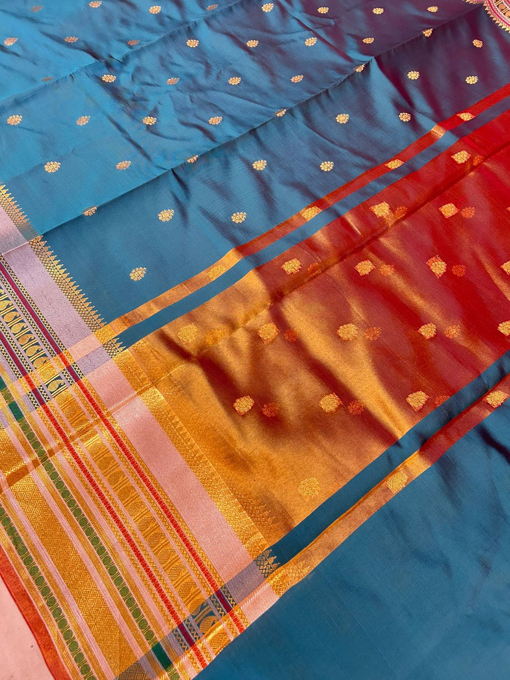 Royal Peacock Blue Banarasi Katan Silk Saree with Rich Zari Buti & Contrast Copper Gold Pall