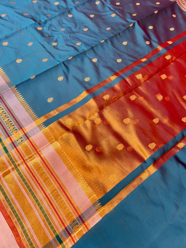 Royal Peacock Blue Banarasi Katan Silk Saree with Rich Zari Buti & Contrast Copper Gold Pall
